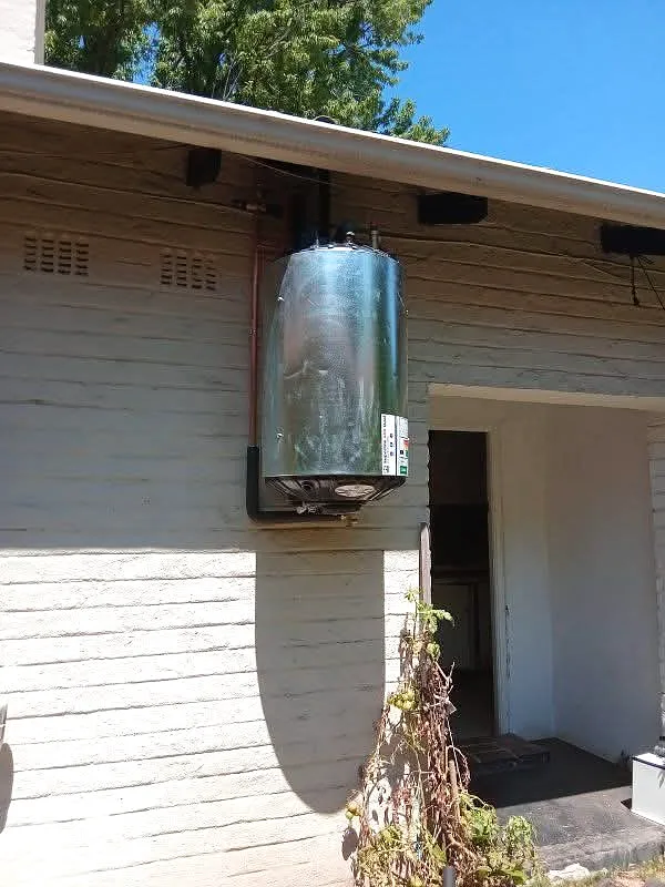 Geyser installed outside under the roof overhang