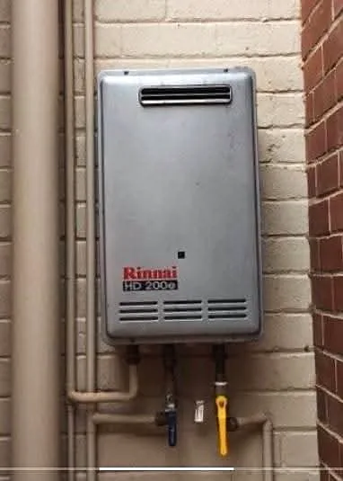 Two gas water heaters installed side by side