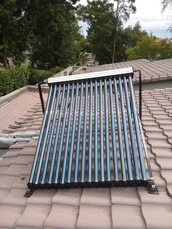 Solar water heating collector installed on a tiled roof