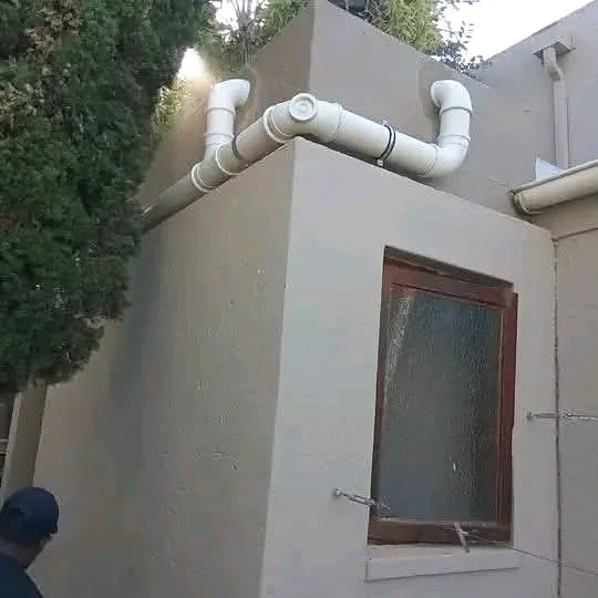 New waste pipework routed neatly up an outside wall