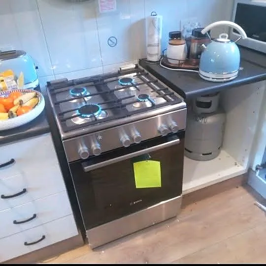Gas stove connected to a cylinder in a kitchen
