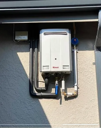 Gas water heater installed under a carport