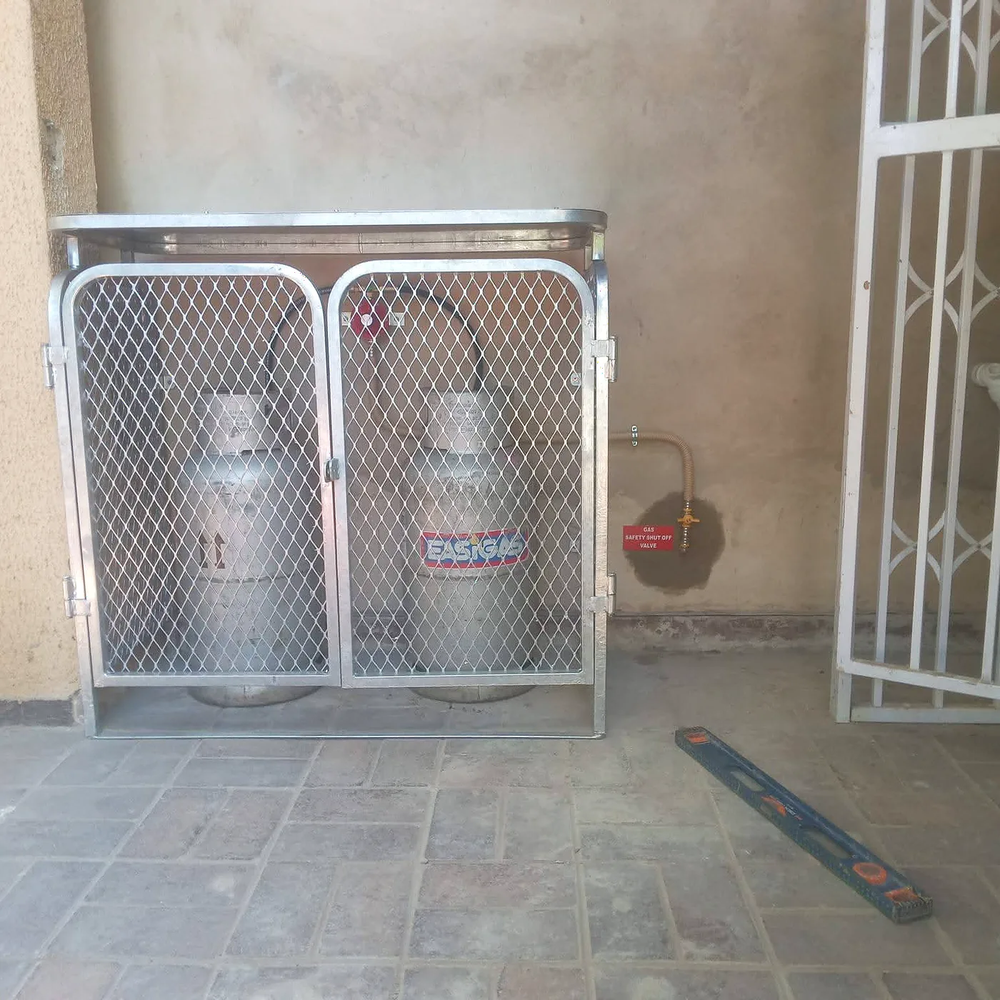 Gas cylinders installed in a secure outdoor cage