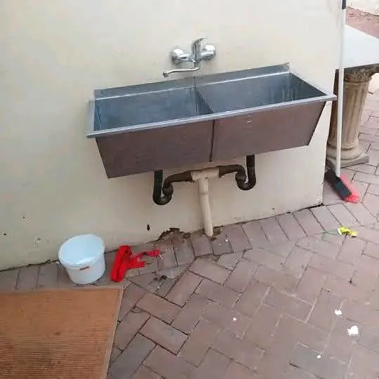 Outdoor wash trough with new waste and water connections