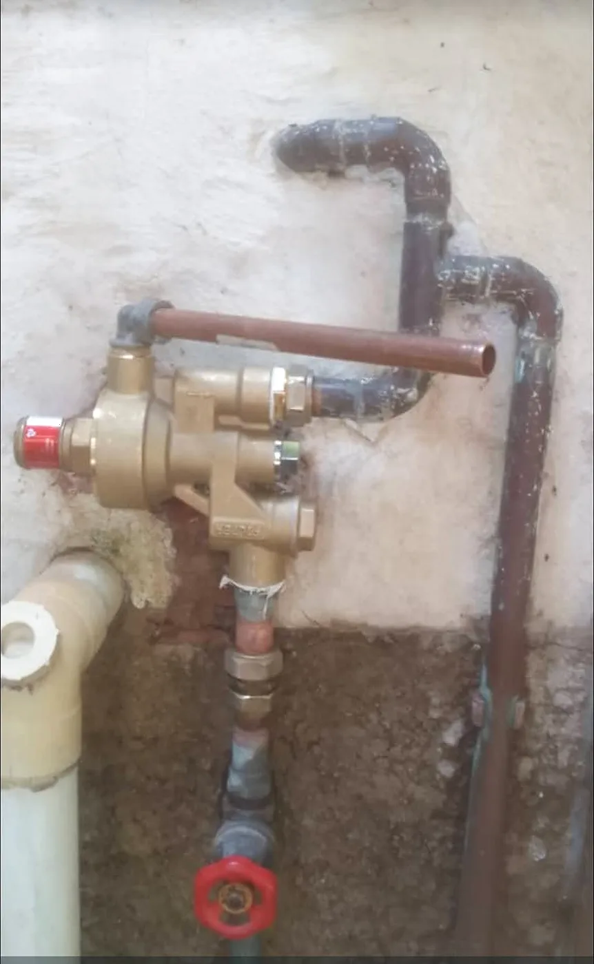 Copper pipework and valves connected on a wall